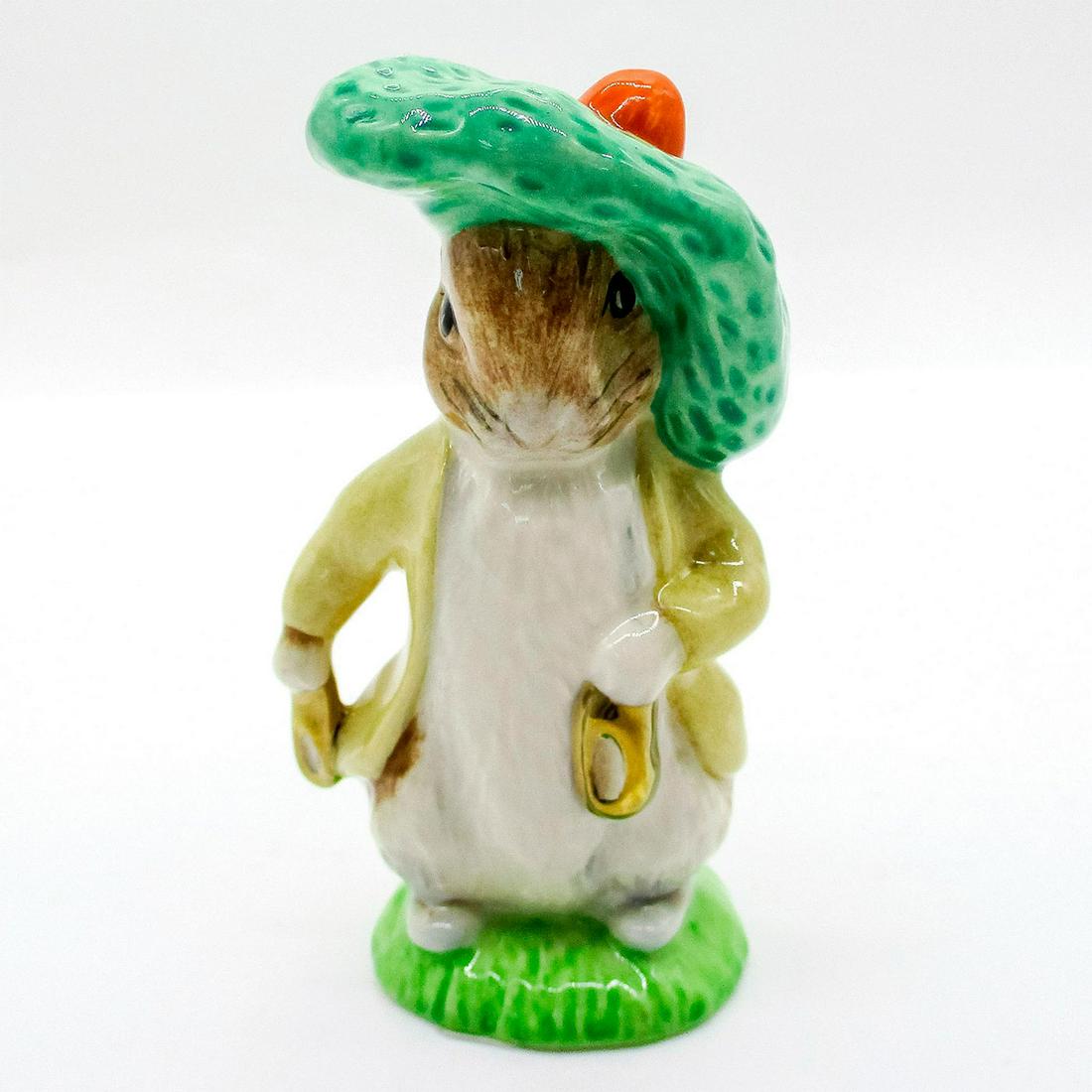 Benjamin Bunny - Beswick - Beatrix Potter Figurine: Porcelain glazed figure of Benjamin Bunny wearing a tan coat and a large green beret holding golden shoes. Beswick Ware Royal Doulton backstamp. Issued: 1997 Dimensions: 4"H Manufacturer: Royal Doulto