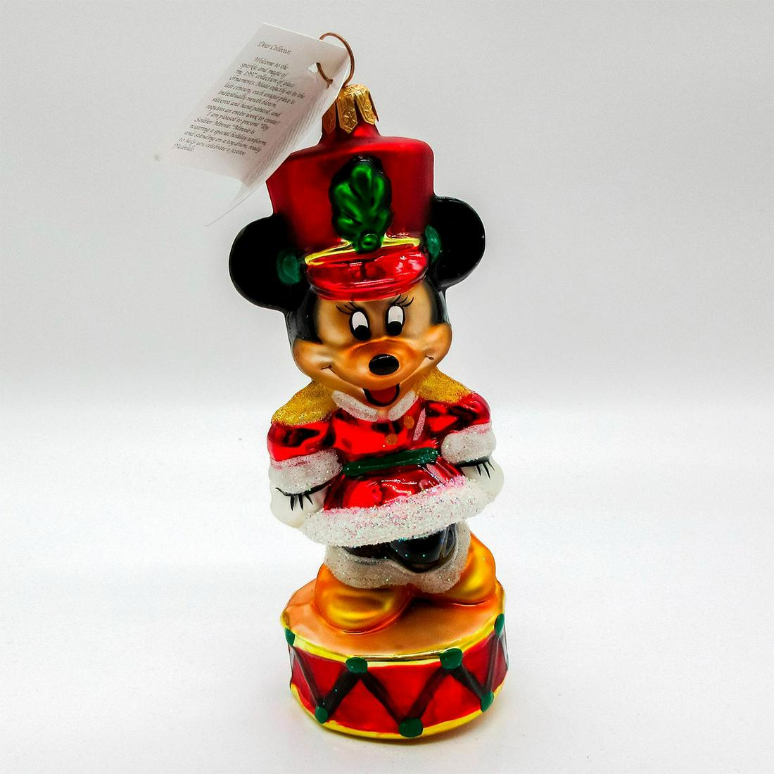 Christopher Radko Christmas Ornament, Toy Soldier Minnie: Colorful glass ornament; features Minnie Mouse dressed in red and white toy solider uniform, Glitter accent. Includes original tag. Comes with original box; 4.25"H x 9"W x 4.5"L. Artist: Christopher R