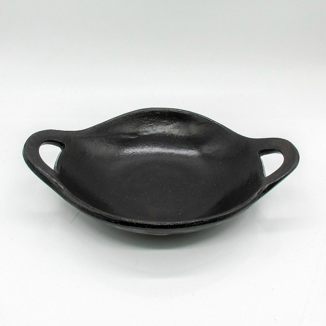 Toban Ceramic Skillet with Two Handles: Clay toban with two handles. Black glaze finish. Unglazed base. Toban translates to 'ceramic skillet' in Japanese. Symbol impressed to base. #donabe #japanesecookware Issued: 21st c. Dimensions: 11" W