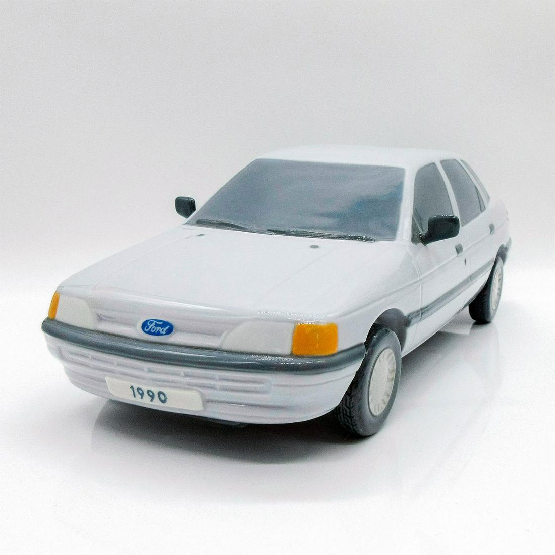 1990 Blue and Gray Ford Escort 1007507 - Lladro Porcelain Figurine: Glossy porcelain. Lladro backstamp. Artist: Jose Roig Issued: 1983 - 1990 Dimensions: 10.75"H x 3.9"W Manufacturer: Lladro Country of Origin: Spain