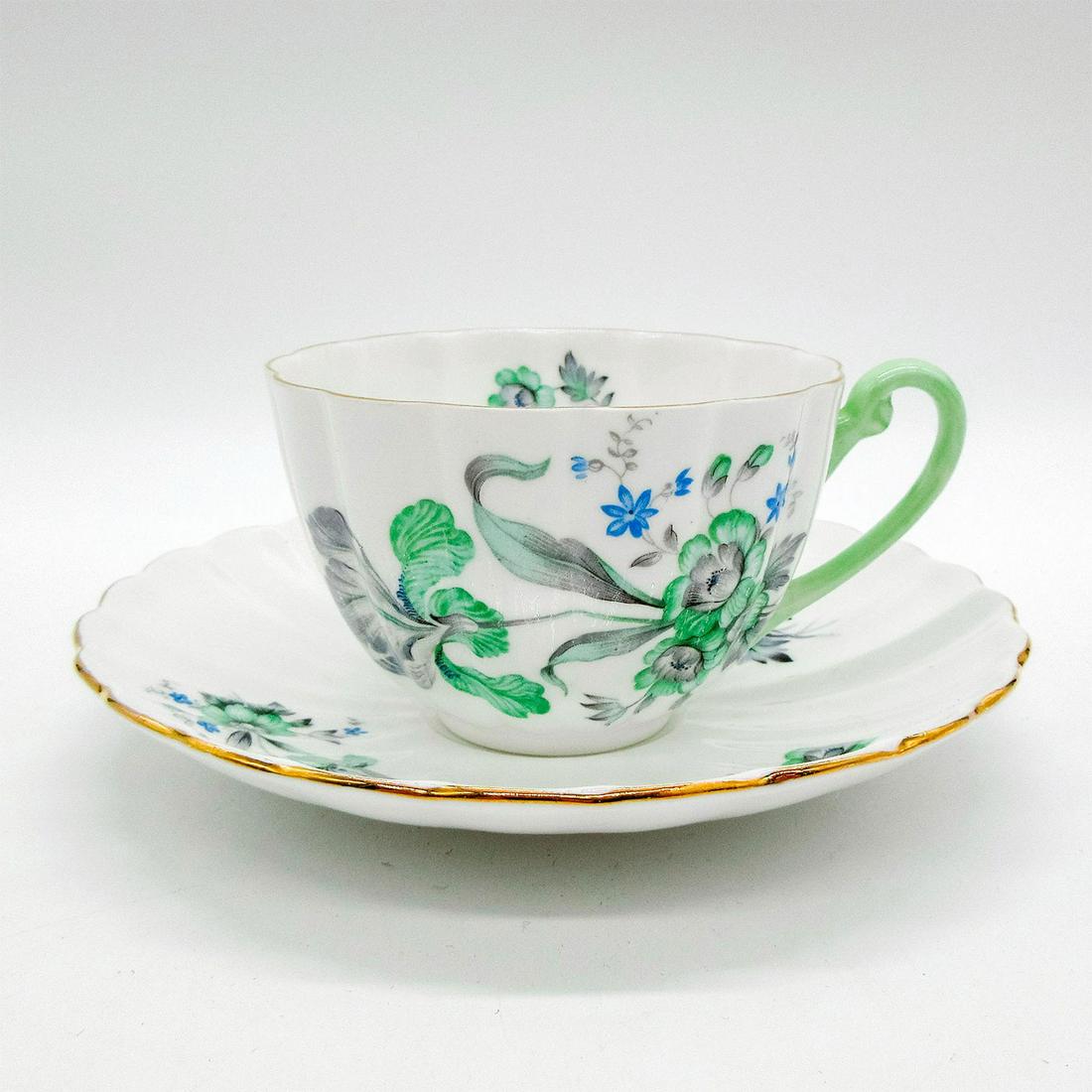 2pc Shelley England Cup and Saucer, Green Iris: Vintage bone china tea wares; Ludlow shape. Green and blue iris flower pattern with gold gilt accents, Shelley England backstamp. 2387 hand-written on base. Scalloped rim. Cup size - 2.25"H x 3.5" dia