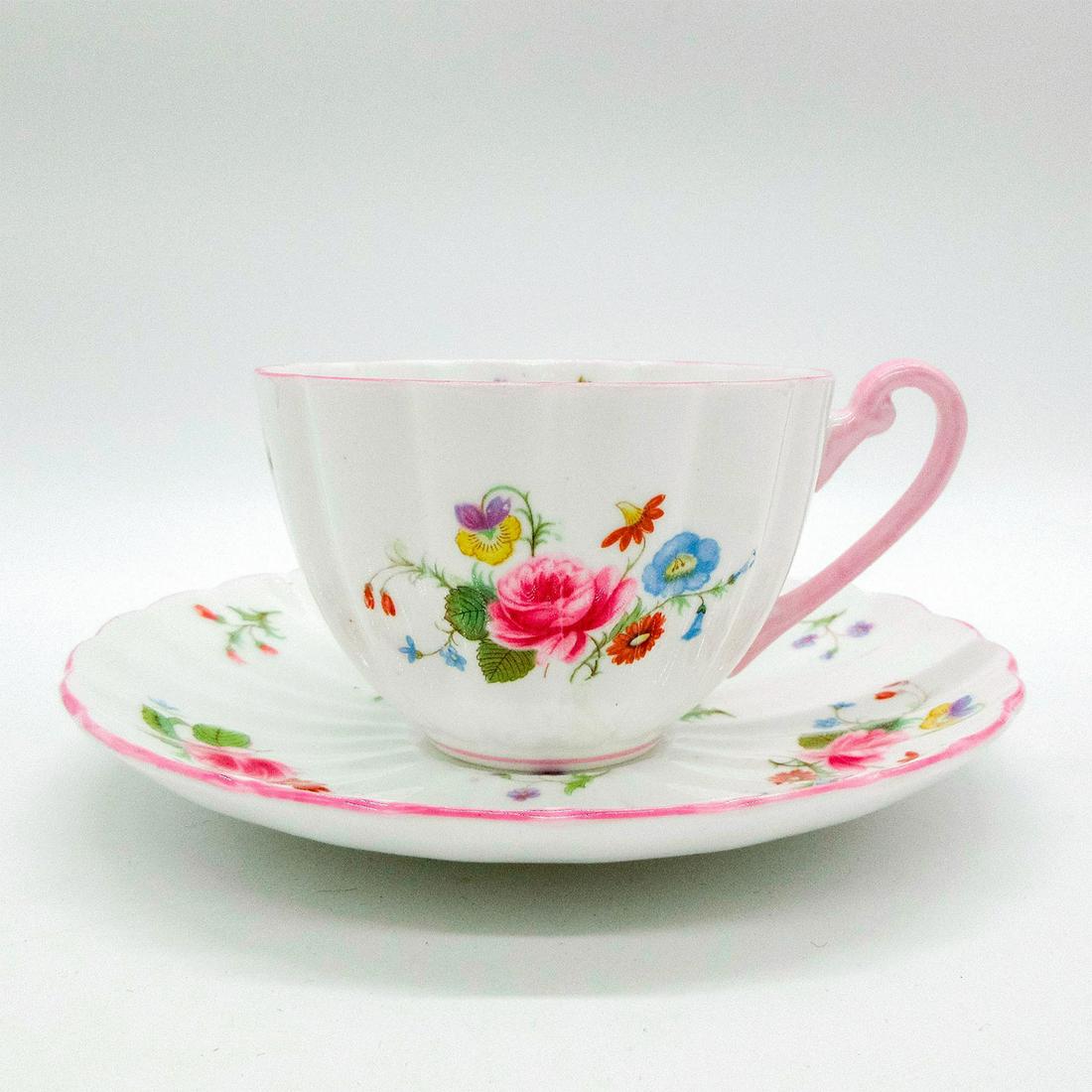 2pc Shelley England Cup and Saucer, Rose and Red Daisy: Vintage bone china tea wares; Ludlow shape. Colorful flower motif with pastel pink scalloped rim. Shelley England backstamp. Cup size - 2.25"H x 3.25" diameter (widest). Saucer size - 0.75"H x 5.75" d