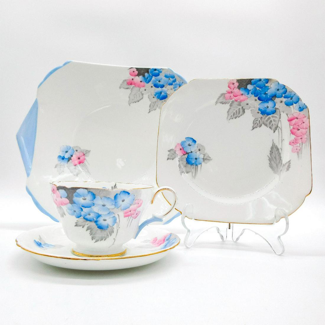 4pc Shelley England Tea Set, Blue Phlox: Bone china tea set; Henley shape. Blue and pink phlox flower pattern with gold gilt accents. Shelley England backstamp. 0170 hand-written on base. Cup size - 2.5"H x 3.5" diameter (widest). Saucer siz