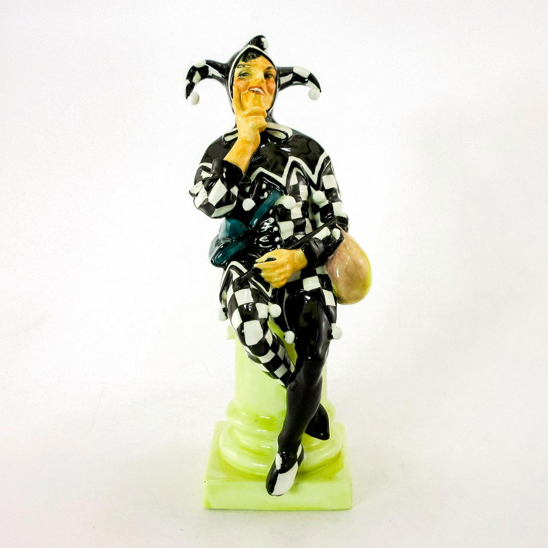 Jester HN45A - Royal Doulton Figurine: Black and white with green pouch. Handwritten in black "Potted by Doulton and Co., C.J. Noke, HN number, A38." Royal Doulton backstamp. Artist: Charles J. Noke Issued: 1915-1938 Dimensions: 10.25"H Ma