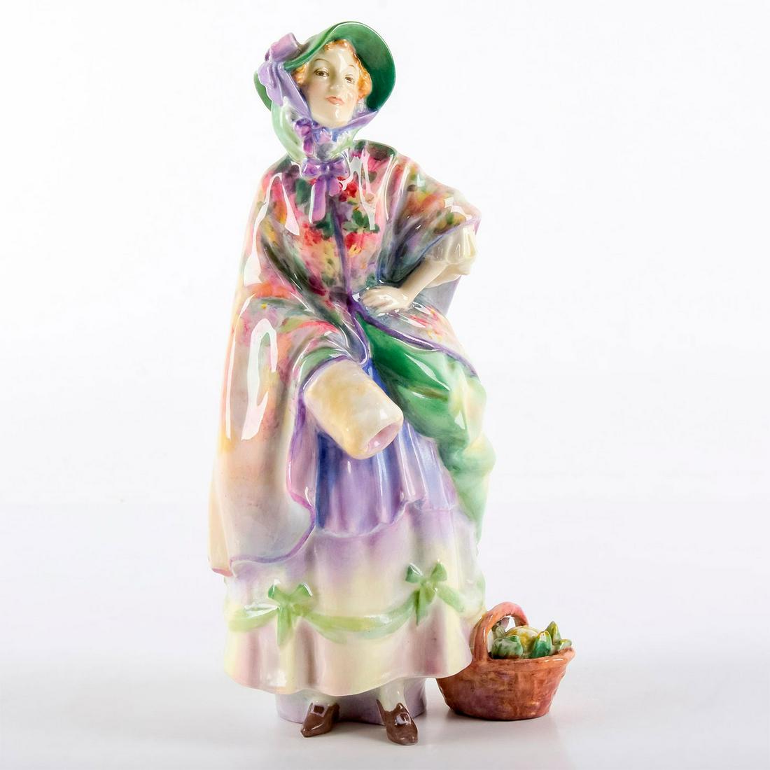 Dolly Vardon HN1515 - Royal Doulton Figurine: She wears a lavender and green dress and bonnet, with multicolored floral cloak. Royal Doulton backstamp. Weight: 12.9 oz #royaldoulton #figurine #leslieharradine Artist: Leslie Harradine Issued: 1932