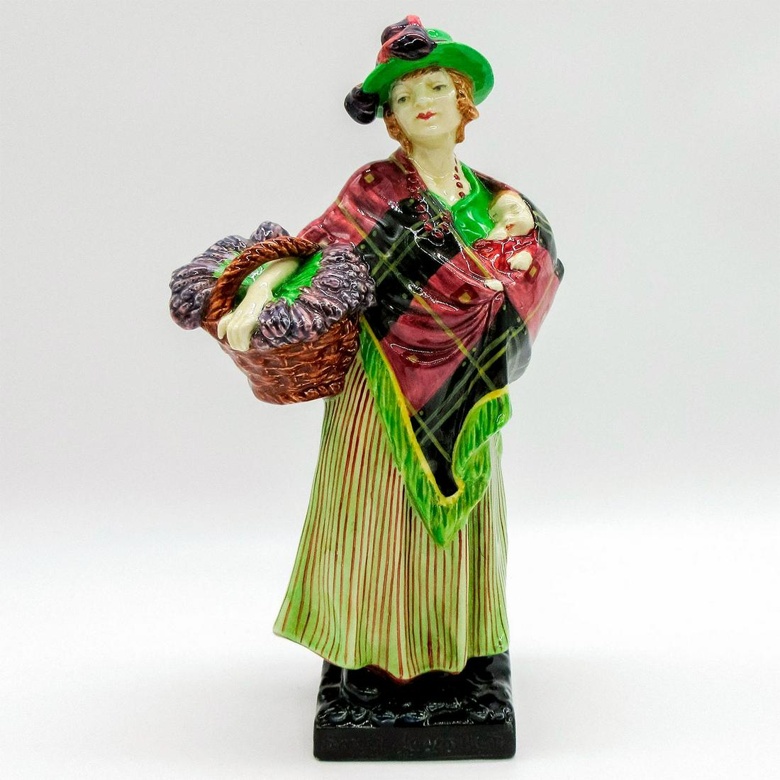 Sweet Lavender HN1373 - Royal Doulton Figurine: Earthenware. Lady holding a basket of lavender. Green, red. and black coloration. Series: Street Vendor. Royal Doulton backstamp. Artist: Leslie Harradine Issued: 1930 - 1949 Dimensions: 9"H Manufactu