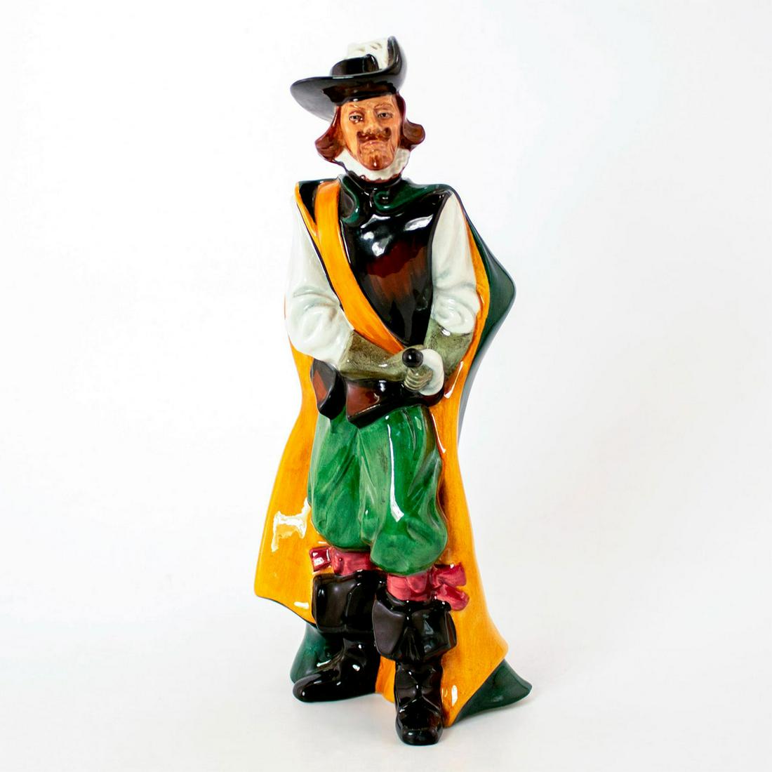 Cavalier HN2716 - Royal Doulton Figurine: Glossy porcelain; brown and green coloration. Grasps his sword by the hilt. Royal Doulton backstamp. Weight - 1lb 6.5oz. Artist: Eric J. Griffiths Issued: 1976 - 1982 Dimensions: 9.75"H Manufacturer: 