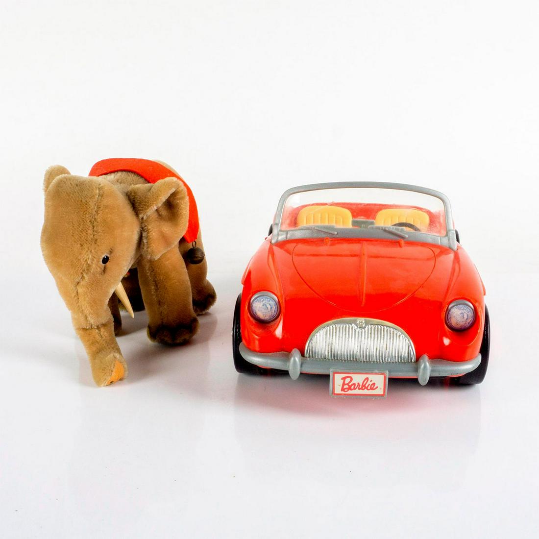2pc Vintage Barbie Car + Steiff Elephant: A 1998 Barbie red Porsche Boxter, and a original Steiff Elephant stuffed plush. Barbie car: 14"L x 8'W x 5.5"H. Elephant: with original Steiff tag. 8.25"L x 4.5"W x 6.25"H. #Barbie #Steiff Issued: 20t