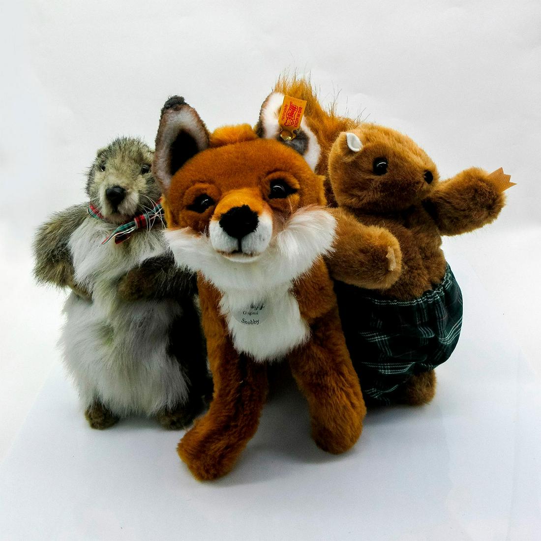 3pc Plush Animals, Fox, Squirrel and Groundhog: Steiff fox 12"H x 19"L, Dormouse Designs squirrel 9.5"H and Hansa groundhog 9"H. Issued: 20th c.