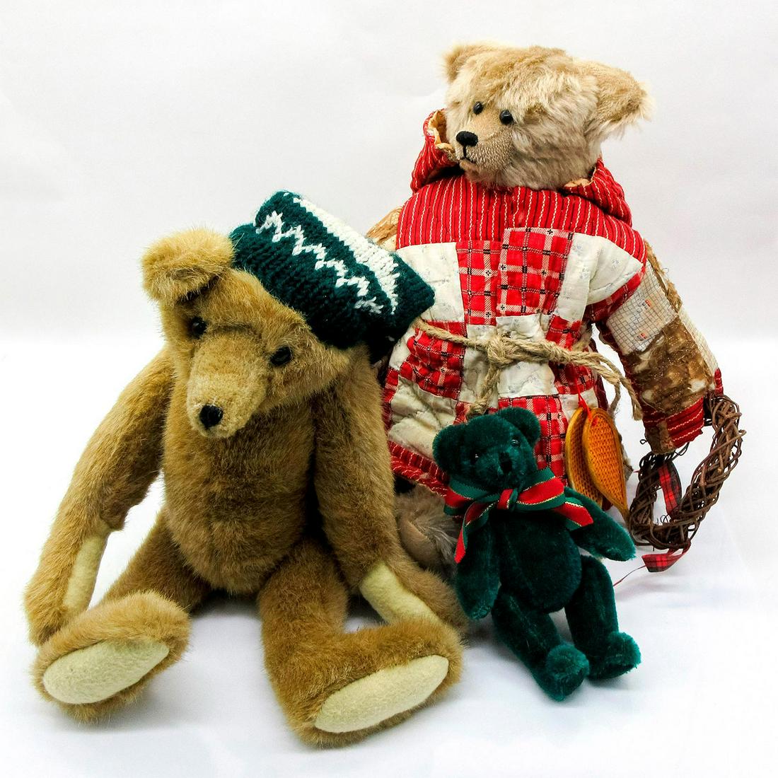 3pc Christmas Teddy Bears: Mary Myer Bear in an emerald green and white woven winter hat, 14"H. Arms, legs and head are moveable. Windsor Bears Santa Bear 13.75"H and includes stand. Arms, legs and head are moveable. The Canter