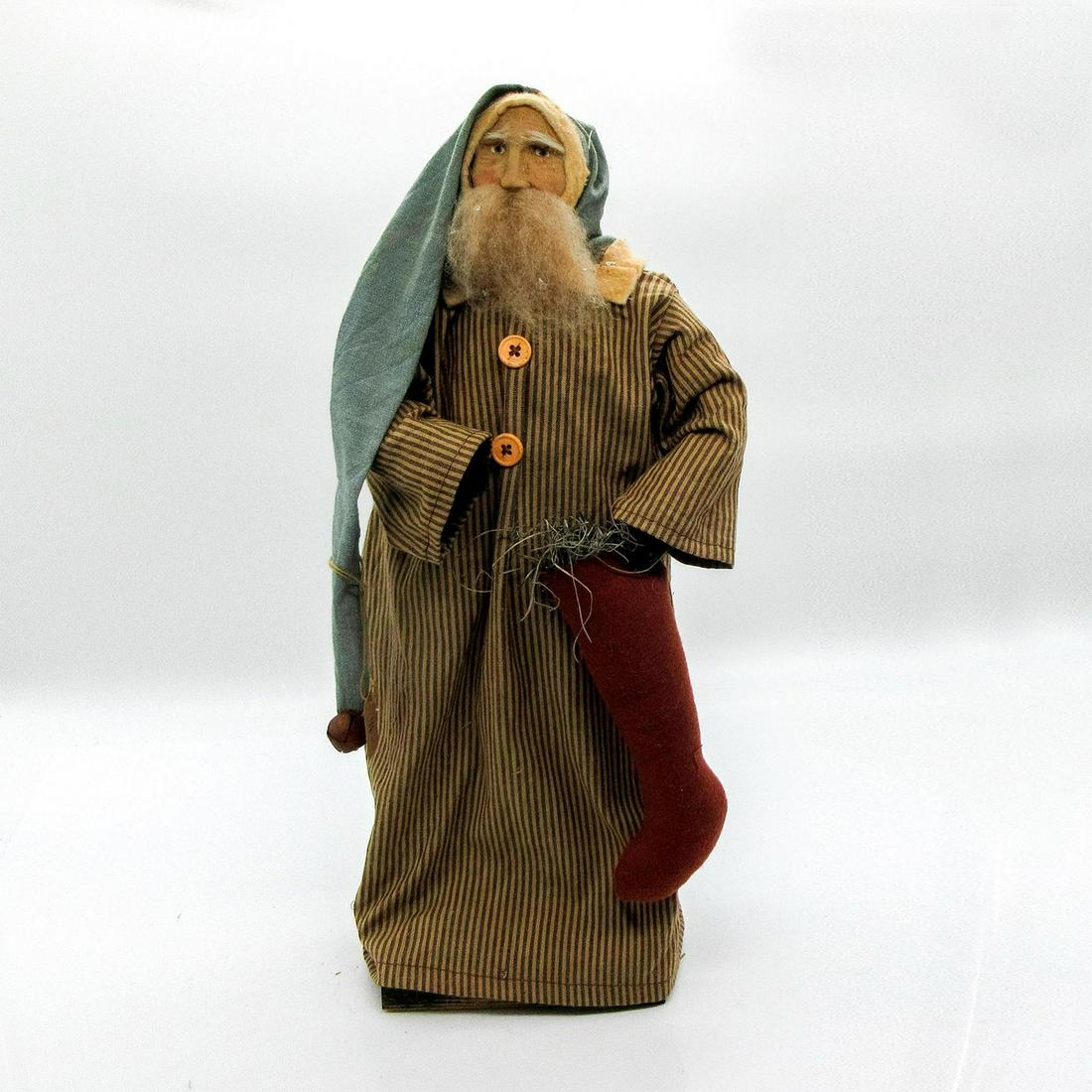 Arnett's Country Store Vintage Pajama Moss Santa Doll: Handmade piece featuring long striped pajama dress with buttons; holding stocking filled with moss. Santa also wears long hat with bell at end. Wooden base attached. Arnett's Country Store USA on bott