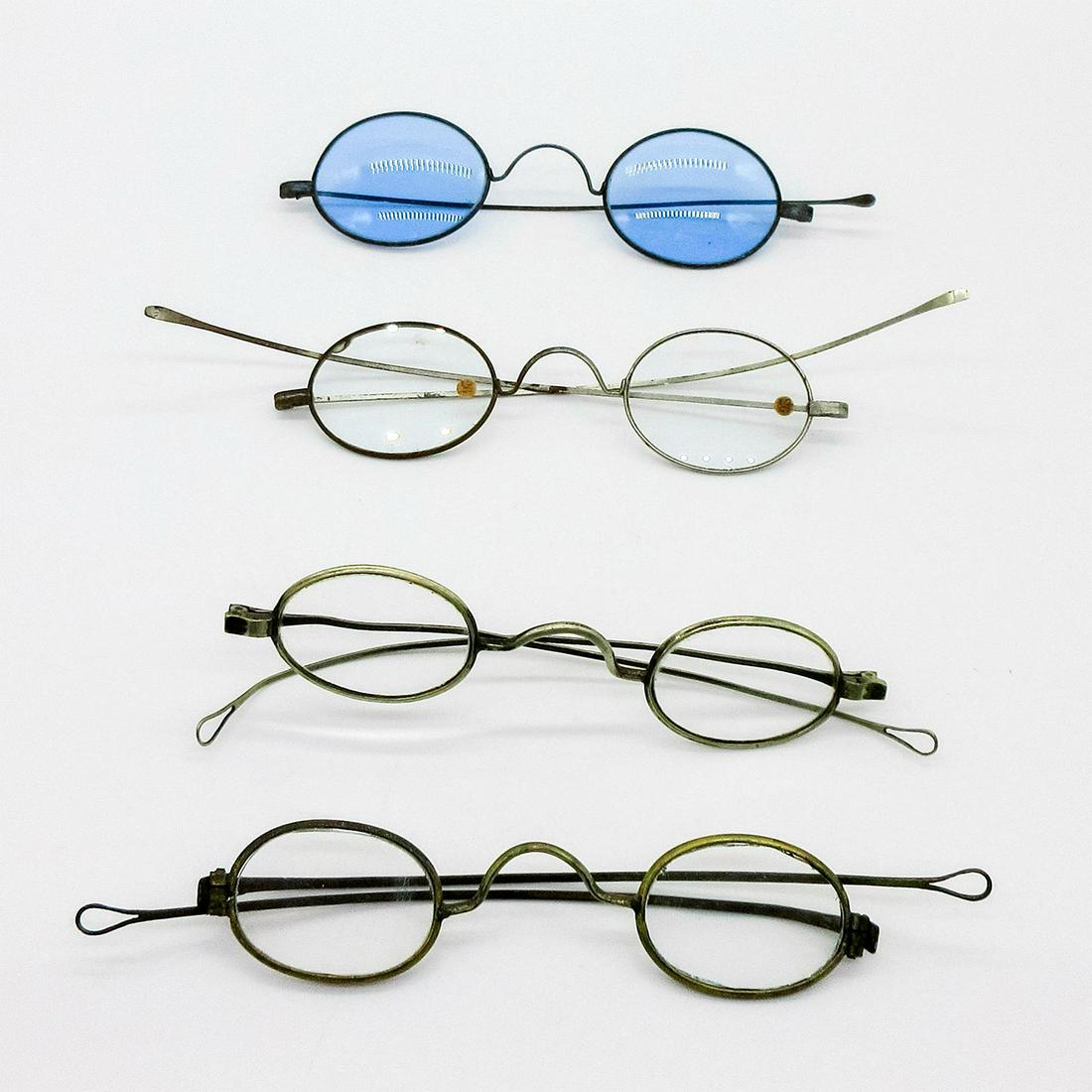 4pc Antique Prescription Spectacles, Metal Alloy Frames: Four pairs of spectacles of various prescriptions and metals. Two straight temples, the other two are tie-end. The blue tint spectacles are missing the left temple. Some spectacles of that era have op