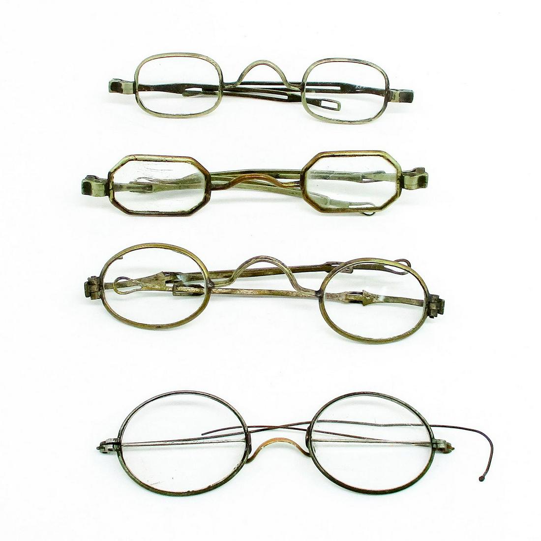 4pc Antique Prescription Spectacles, Metal Alloy Frames: Four pairs of spectacles of various prescriptions and metals. One loop around, the other three are tie-end. Some spectacles of that era have open ends on the temples that were held on by a string or r