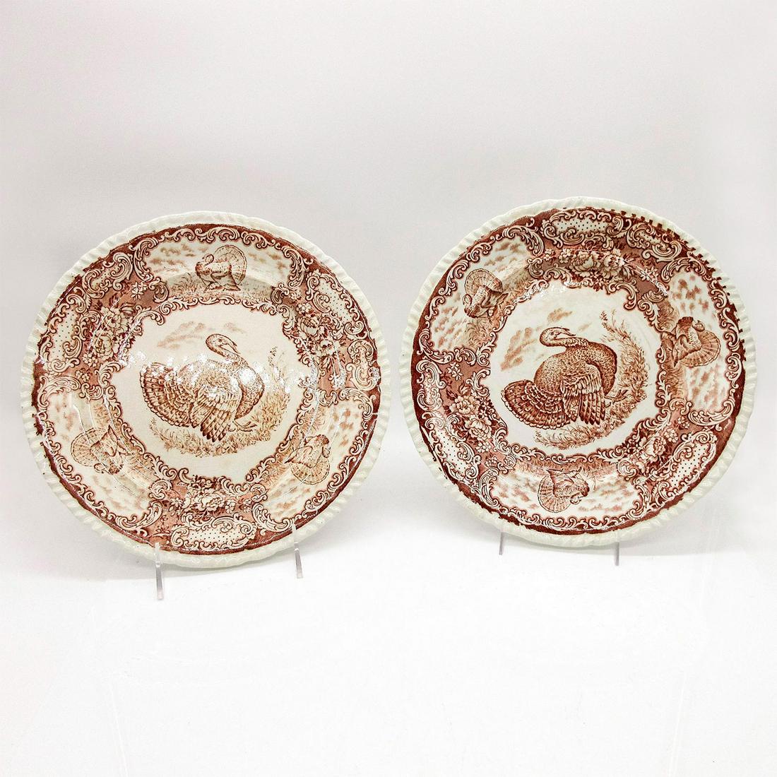 2pc Antique Staffordshire English Porcelain Turkey Platters: Pair of Transferware plates in cream and brown colors depicting turkeys and flowers. Green Staffordshire backstamp.#Art #England #Thanksgiving Issued: 20th c. Dimensions: 1"H x 10" dia. Manufacturer: 