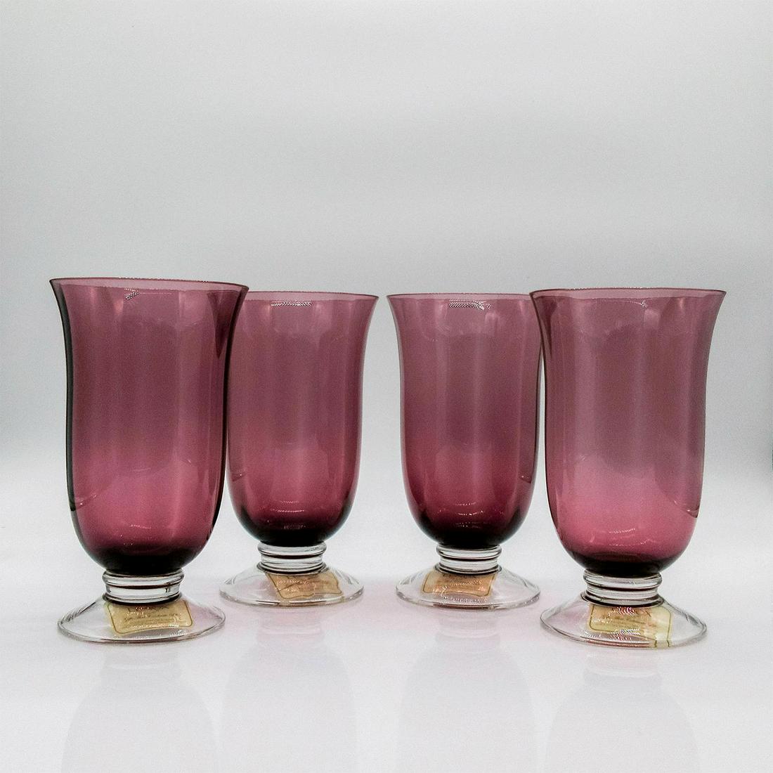 4pc Lenox Highball Glasses, Amethyst: Elegant trumpeted highball glasses with flared base. Dark amethyst in color. Lenox stamped to base. Original box included. Box dimensions: 8"H, 9"W, 9"L. #Lenox Issued: 21st c. Dimensions: 6.5" H Manu