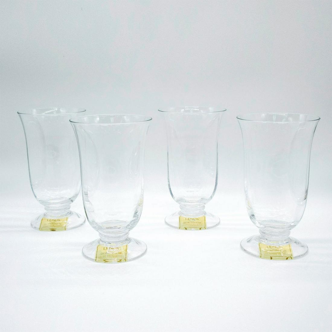 4pc Lenox Clear Highball Glasses: A set of footed transparent glass tumblers. Includes original box: 9"L x 9"W x 8"H. Lenox stickers and acid marks. #Lenox #Highball Issued: 20th c. Dimensions: 6.5" H x 3.75" Diameter Manufacturer: Le