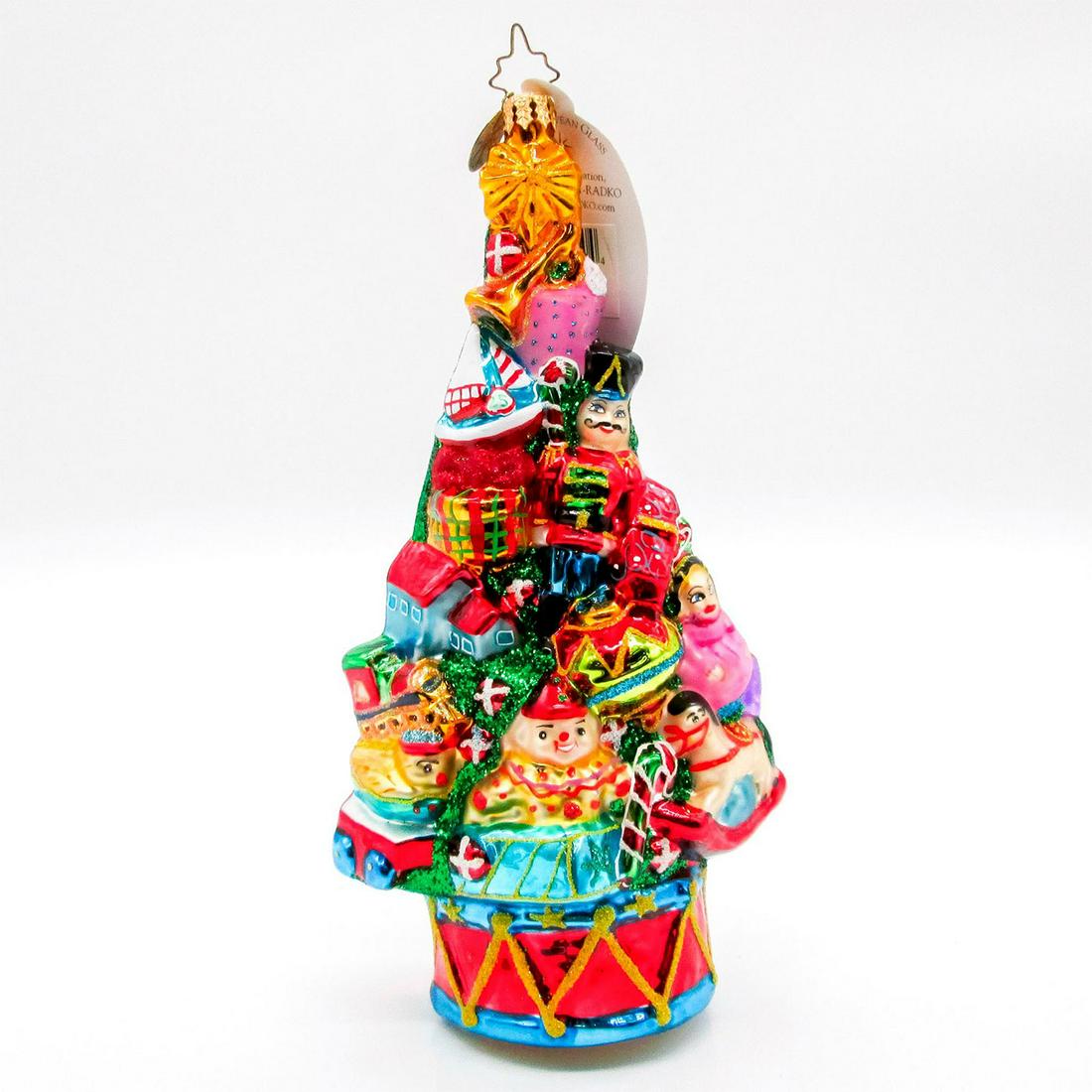 Toyland Tannenbaum, Christopher Radko Ornament: Christmas tree decorated with gifts atop a drum, glitter embellishment, made with European glass. Includes original Christopher Radko box. #radko #ornament #tree Artist: Christopher Radko Issued: 2007