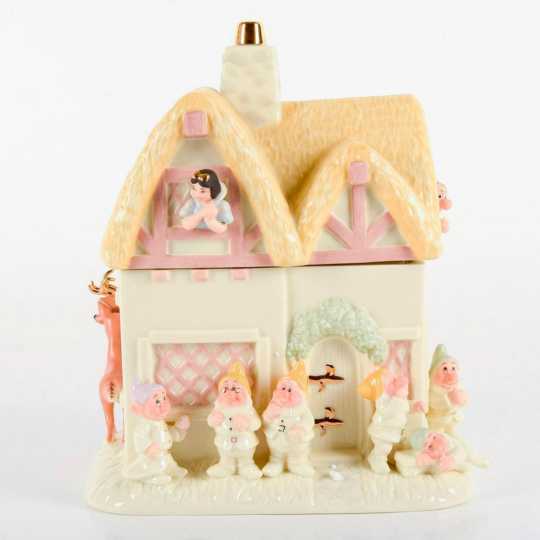 Lenox Cookie Jar, Snow White and the Seven Dwarves: Ivory fine china with hand-painted 24k gold and pastel colored details. Featuring Snow White, dwarves, and animals. Lenox backstamp. Made for the Disney Snow White and Seven Dwarves Home Decor Collect