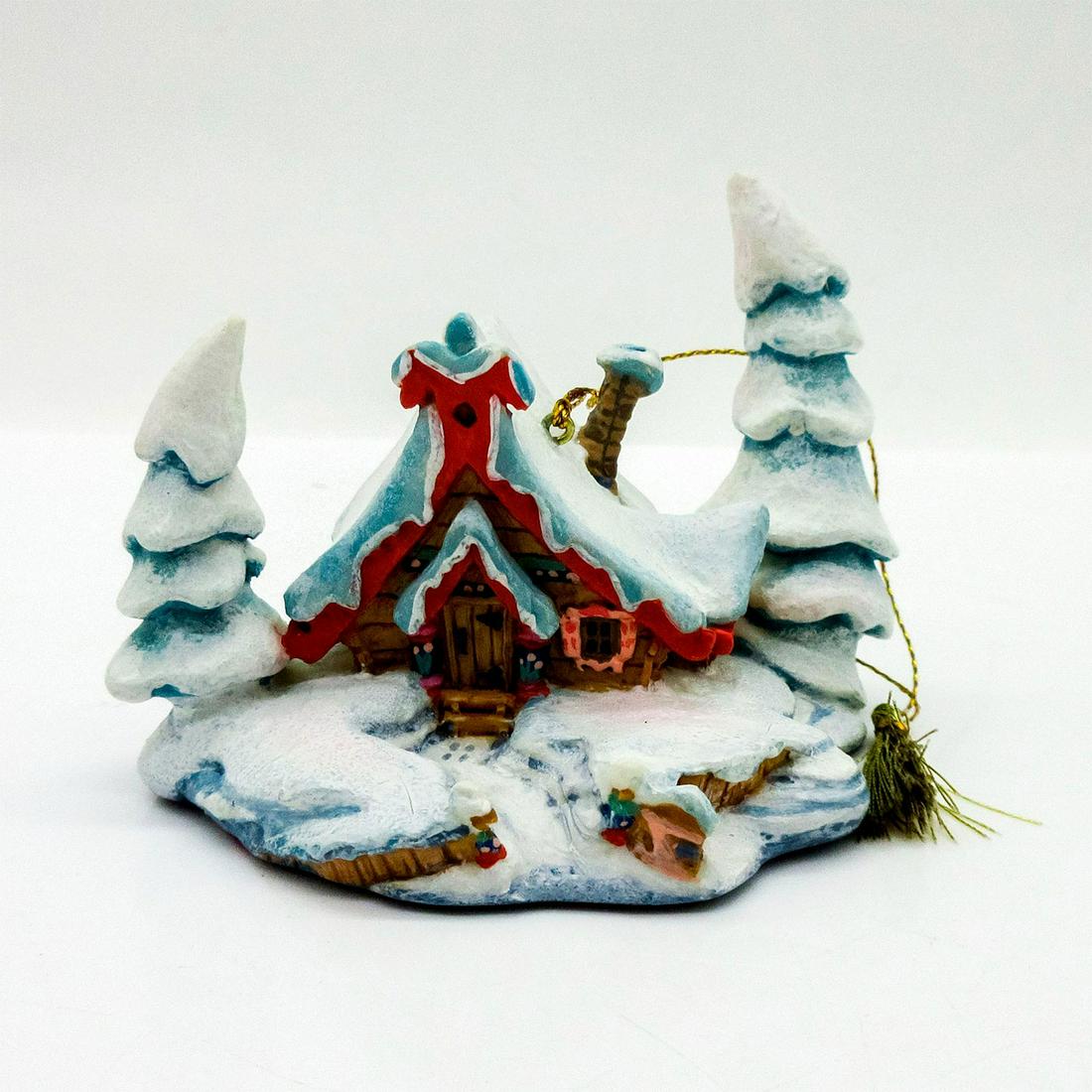 Disney Ornament, Nestled in the Snow, Peter and the Wolf: Resin ornament of a wintry snow-covered scene of idyllic cottage in the woods from Peter and the Wolf. Walt Disney Classics Collection backstamp. In original box, 3.5"H x 7.5"W x 5"L. Includes Certifi