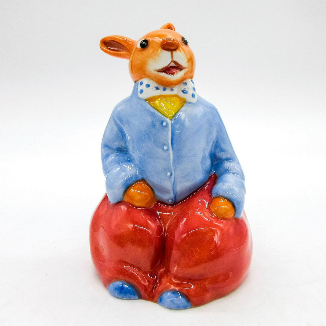 Billy DB476 - Royal Doulton Bunnykins: Glazed porcelain sitting bunny in red and blue ensemble. Royal Doulton backstamp on bottom. Signed by Michael Doulton. Artist: Charles Noke in 1913 Issued: 20th c. Dimensions: 5"H Edition Number: 190
