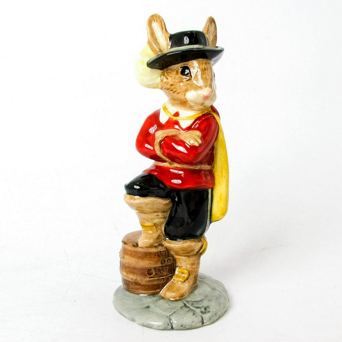 Cavalier Bunnykins DB179 - Royal Doulton Bunnykins: Red tunic, white collar, black trousers and hat, yellow cape, and light brown boots. Royal Doulton backstamp. Signed by Michael Doulton. Artist: G. Tongue Issued: 1998 Dimensions: 4.5"H Edition Number