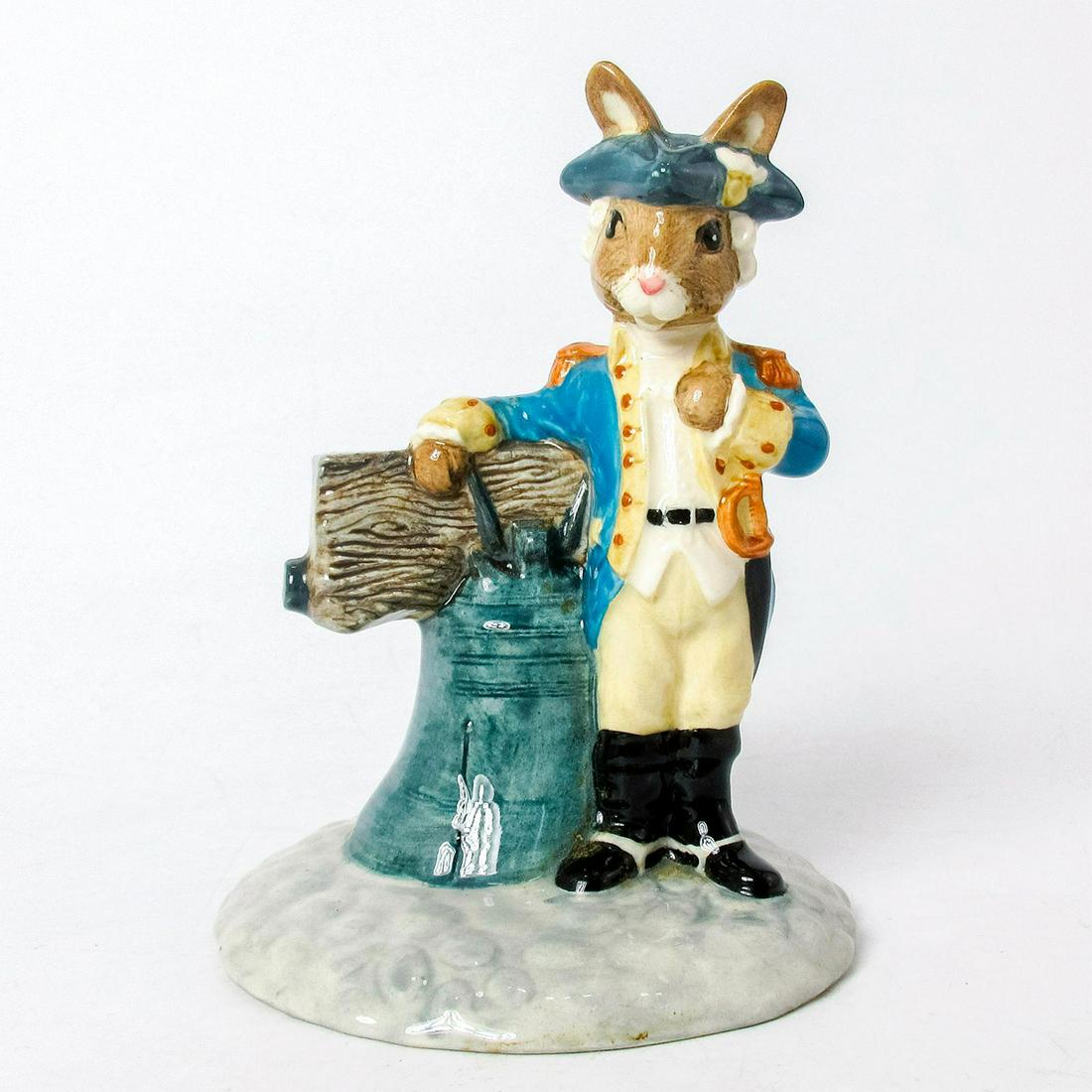 Liberty Bell DB257 - Royal Doulton Bunnykins: Royal Doulton Bunnykins, Liberty Bell Bunnykins DB257 (turquoise, white, grey, beige, and black coloration). Royal Doulton backstamp. Artist: Shane Ridge Issued: 2001 Dimensions: 5"H Edition Number: 7