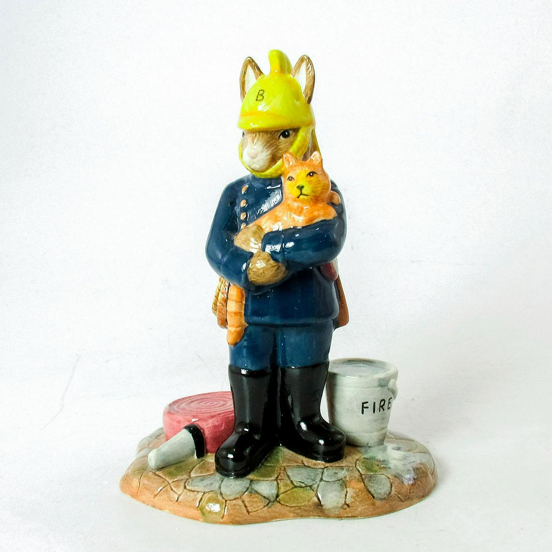 Fireman DB376 - Royal Doulton Bunnykins: Dark blue uniform, black boots, yellow hat, grey pail, red fire house and ginger cat. Royal Doulton backstamp. Original box and certificate of authenticity included. Issued: 2005 Dimensions: 4.75"H Ma