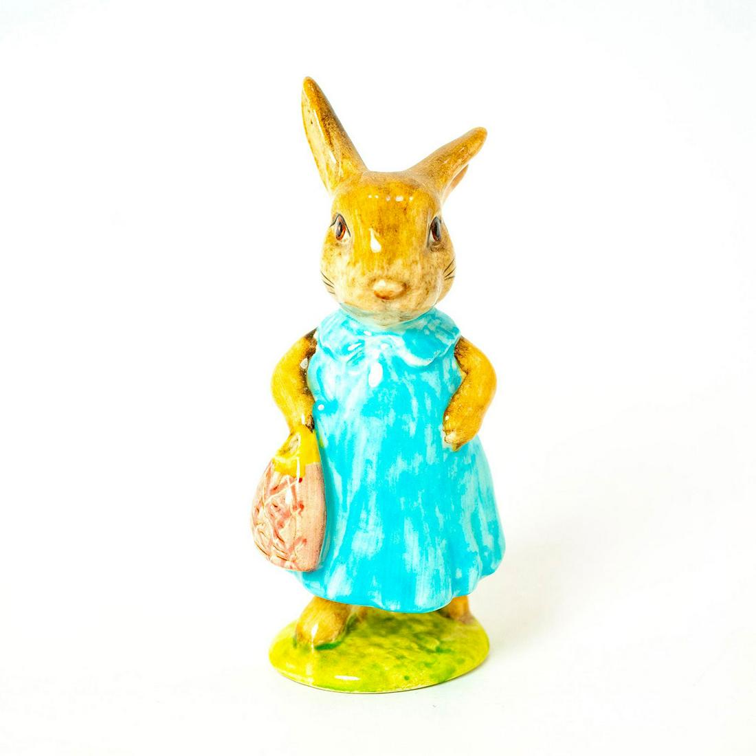 Mrs. Flopsy Bunny - Beswick - Beatrix Potter Figurine: Beswick Backstamp. Dark/ Light blue dress, pink bag. Artist: Arthur Gredington Issued: 1977 - 1982 Dimensions: 4"H Manufacturer: Beswick Country of Origin: England