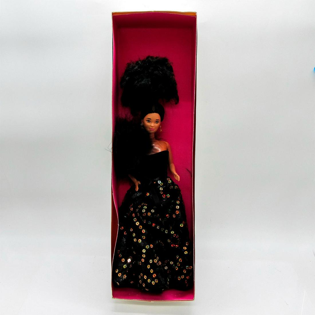 Vintage Mattel Bob Mackie Doll: In original Anucha Toys pink box. Original box included. Dimensions of box: 17.25"L x 5.25"W x 3"H. #Mattel #BobMackie Issued: 20th c. Dimensions: 11.5"H Manufacturer: Malaysia Country of