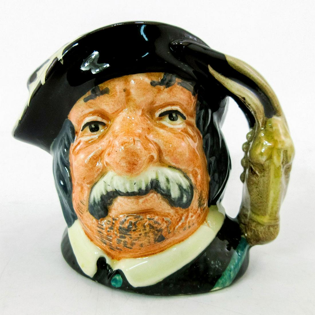 Sancho Panca D6518 - Mini - Royal Doulton Character Jug: Black hat with a white feather; black coat with a white collar. This amiable peasant was employed as the squire to Don Quixote in Cervantes's 17th-century novel. Accompanying Quixote on many adven