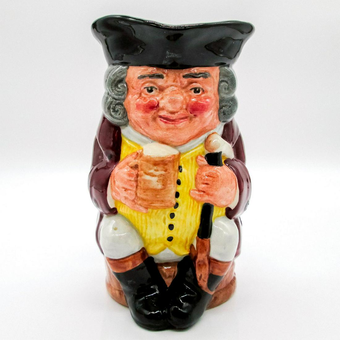 Jolly Toby Blue - Royal Doulton Toby Jug: Black hat; burgundy coat; yellow waistcoat with 7 buttons; blue-grey breeches. English (UK) Heritage series. Royal Doulton backstamp. Artist: Harry Fenton Issued: 1939-1991 Dimensions: 6"H Manufacture