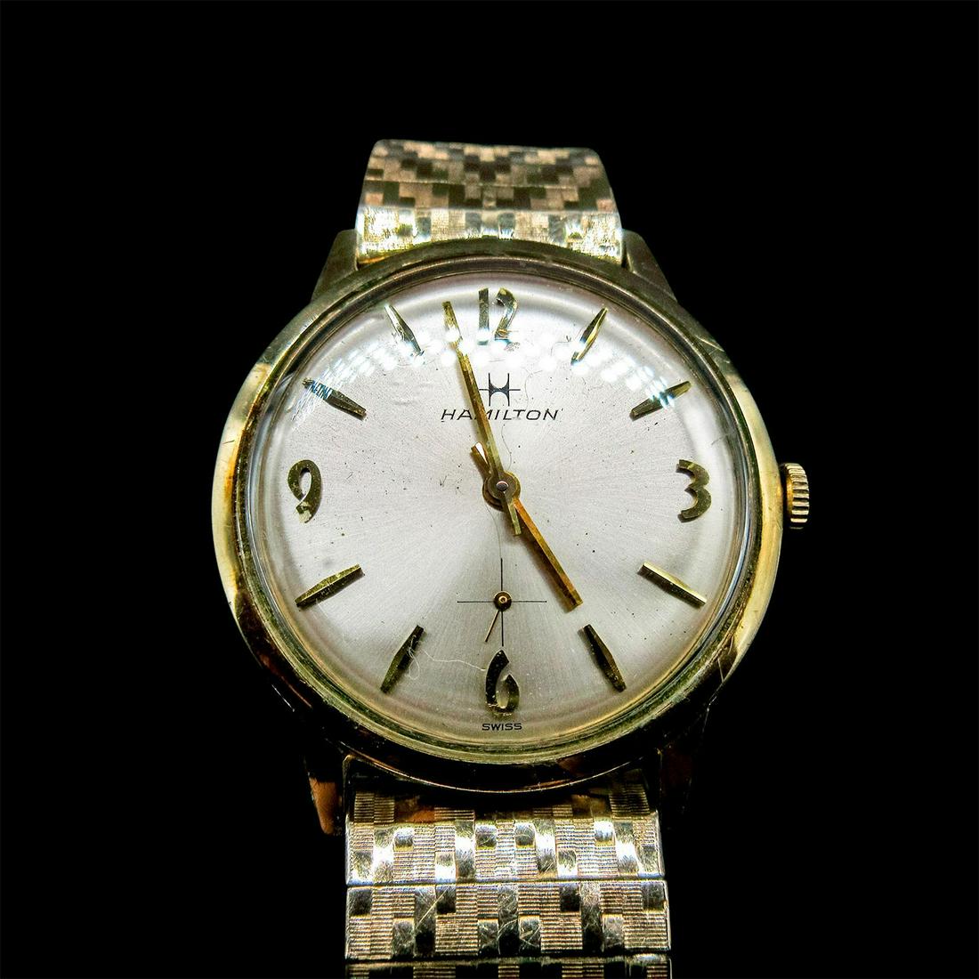 Vintage Hamilton 10K Gold Watch: Stamped 10K gold filled bracelet and Hamilton stamp to back. 33mm bezel with brushed pearlescent white watch face. Elastic bracelet has gold filled caps with stainless steel backing. #hamilton This lo