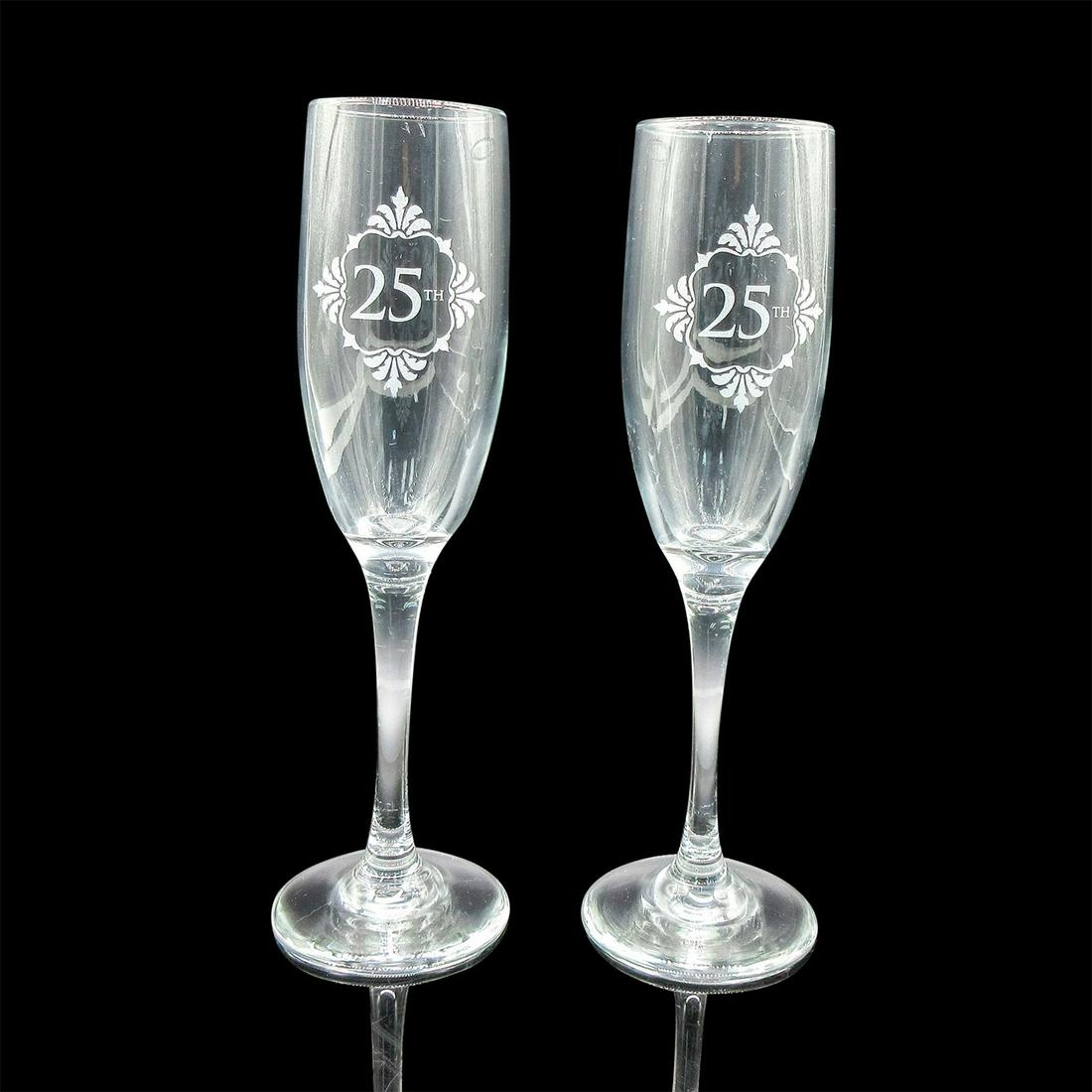 2pc Hortense B. Hewitt Champagne Flutes, 25th Anniversary: Clear glass champagne flutes with metallic silver "25th" decal. Original box included. Box dimensions: 4.75"H x 11"W x 8"L. Issued: 21st c. Dimensions: 9"H Manufacturer: Hortense B. Hewitt Co. Country