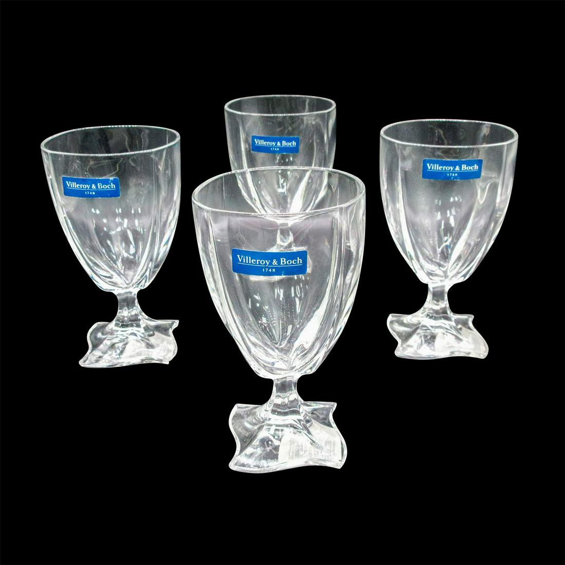 4pc Villeroy & Boch Crystal Wine Goblets, New Wave: Clear 24% lead crystal drinkware with a square wave-like foot. Includes original box: 7.25"L x 7.25"W x 6.25"H. Villeroy & Boch acid mark and sticker.#Villeroy&Boch #LeadCrystal #WineGoblet #NewWaveWa