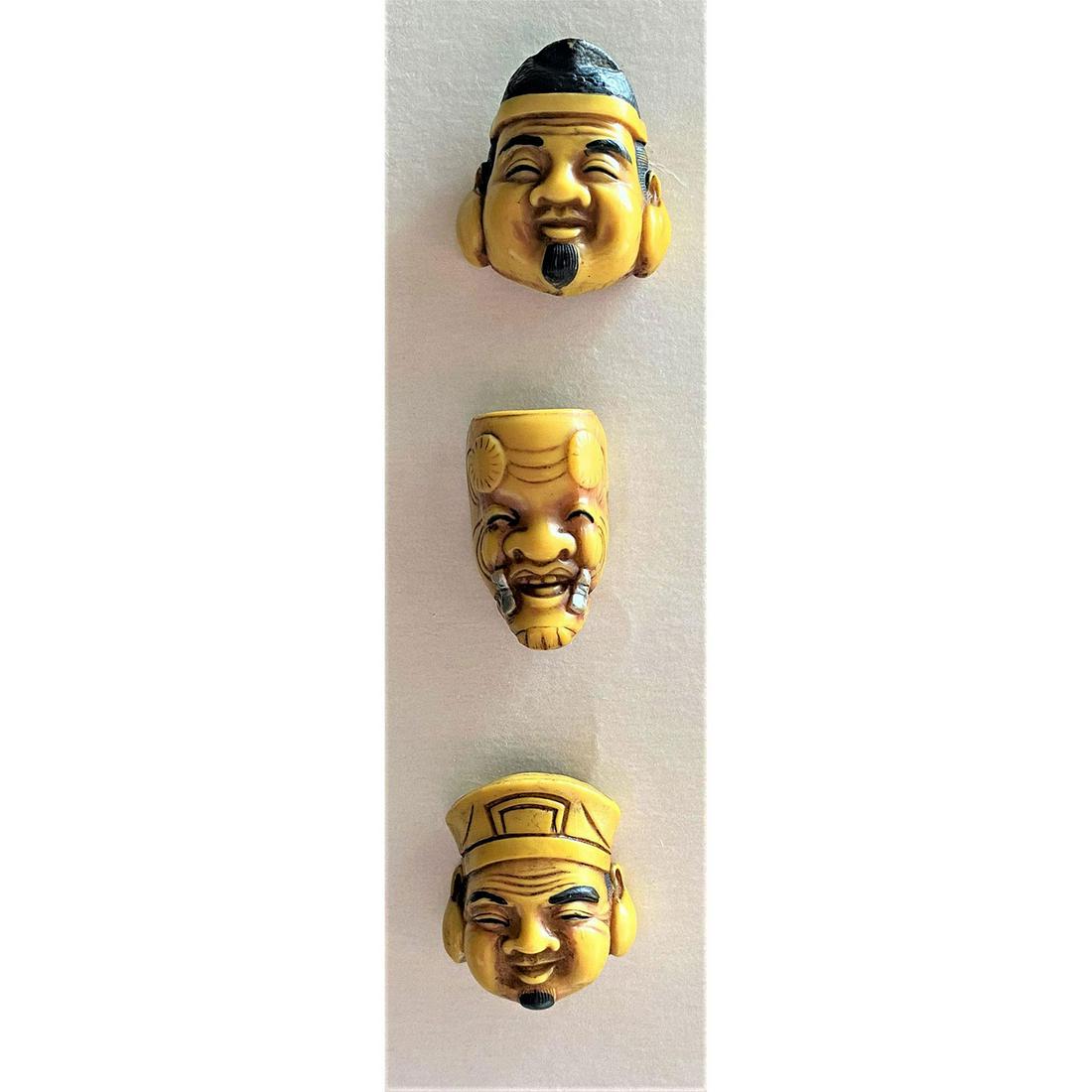 A Small Card of Carved Netsuke heads (1 of 5)