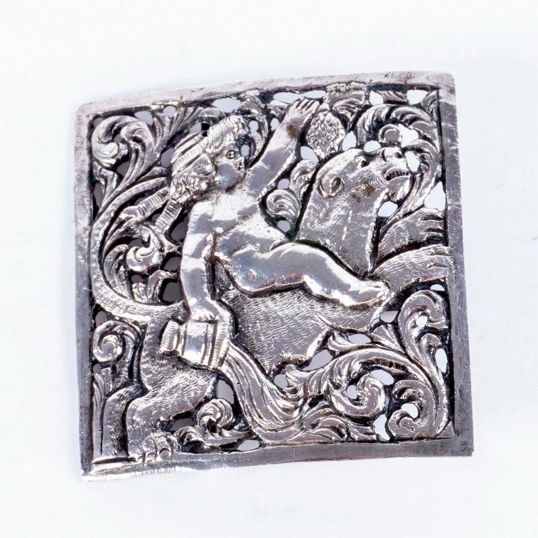 A 1 Piece Late 19Th Century Pictorial Sterling Buckle: Sterling Classical Motif Belt Buckle Diamond-shaped buckle of baby Dionysus riding a lioness, and holding wine and grapes. Weight: 22g Anchor, Lion, and 'e' impressed stamps. A.J.S. hallmark. Issued: 