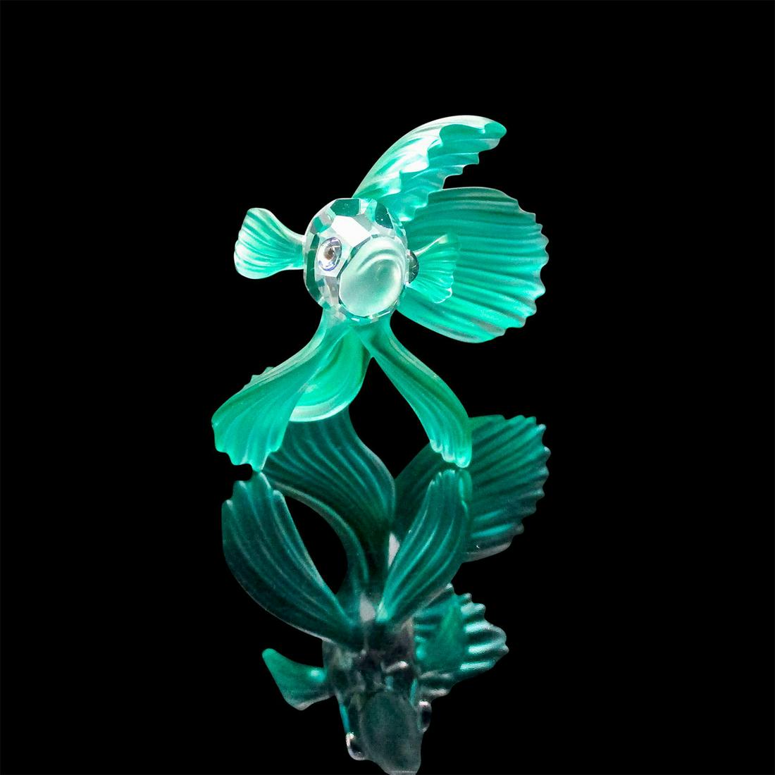 Swarovski Crystal Figurine, Green Siamese Fighting Fish: Lead crystal figure of Siamese fish with frosted mouth and green fins and tail. Part of the "South Sea" collection. Swarovski etched backstamp. Includes original box: 5"W x 4"H x 4.75&