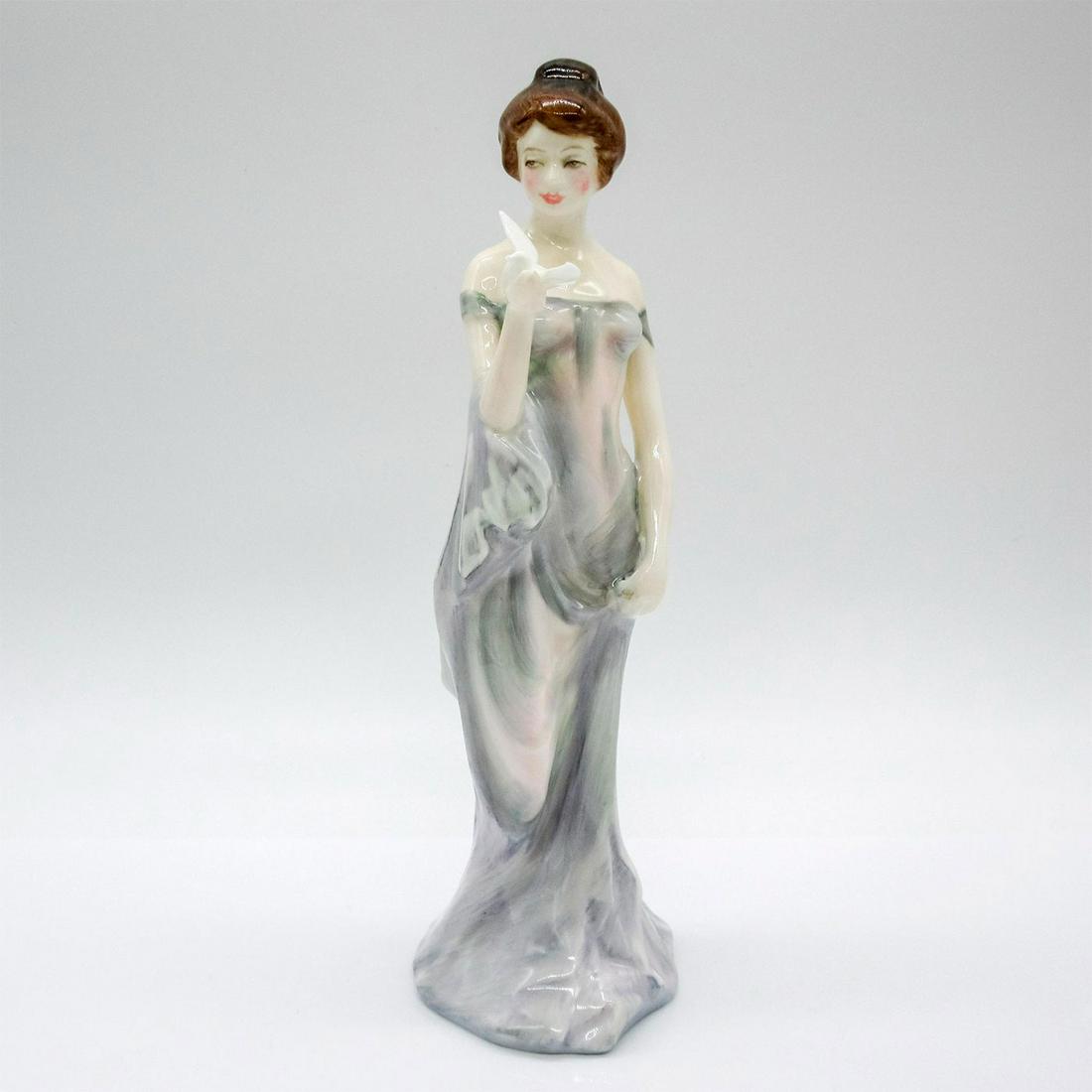 Royal Doulton Figurine, Harmony HN2824: Classic Pretty Ladies collection. Lady in purple-grey dress. Holding a dove. Royal Doulton backstamp. Issued: 1978-1984 Dimensions: 8" H Manufacturer: Royal Doulton Country of Origin: England This ite