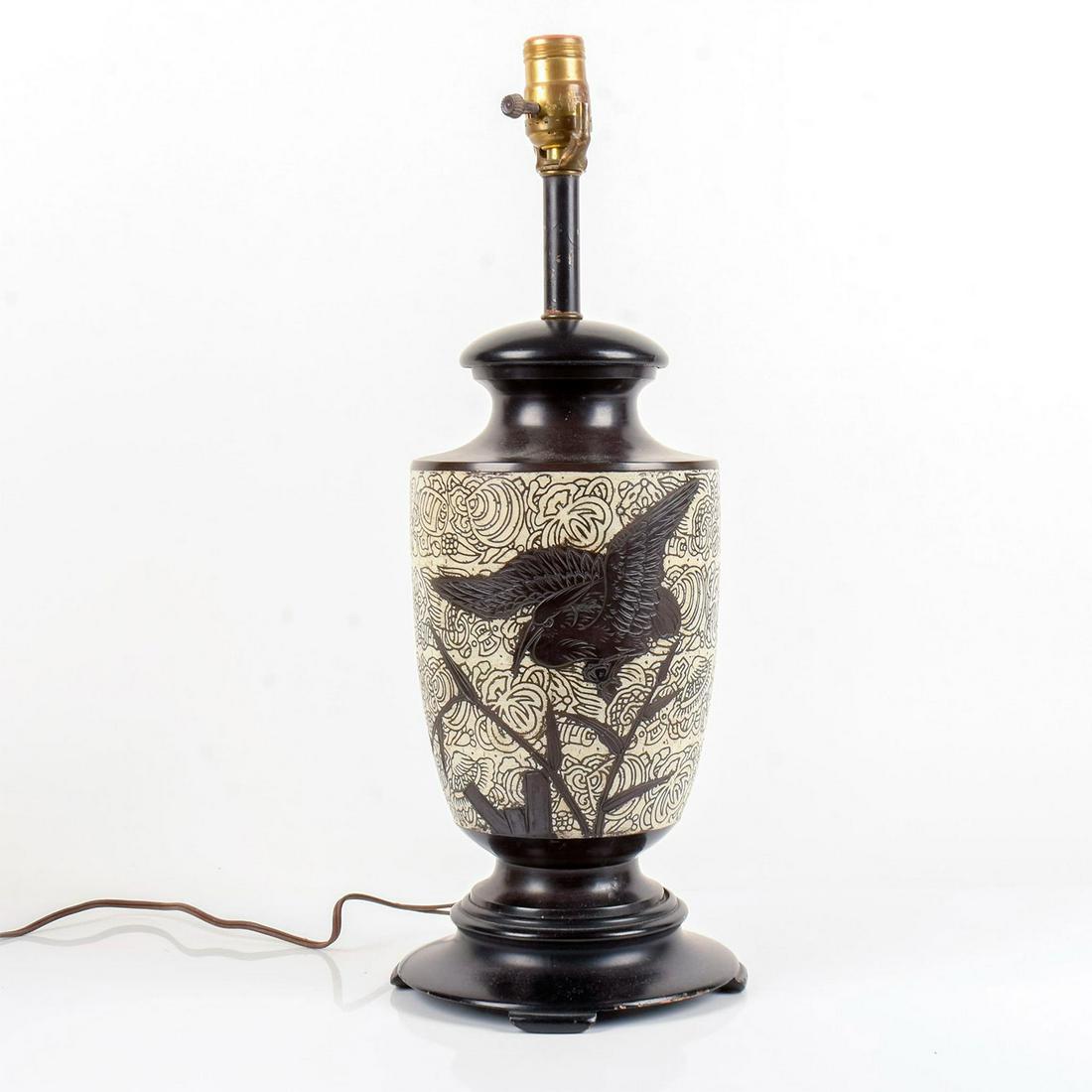 Antique Japanese Stork Table Lamp: A black and white lamp; engraved bird flying over a bamboo tree. Black intricate designs over white body. Dimensions: 19.5" H x 6.5" Diamater This item has no reserve.