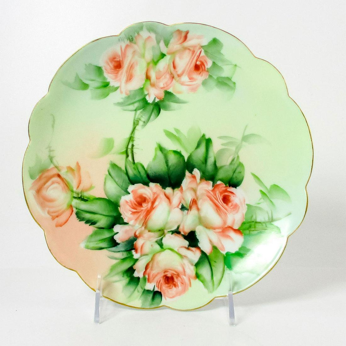 Antique Limoges France Porcelain Collectors Plate: Scalloped gilded rim. Hand painted flowers in the center. Limoges backstamp. Dimensions: 1" H x 8.5" Diameter Manufacturer: Limoges Country of Origin: France This item has no reserve.