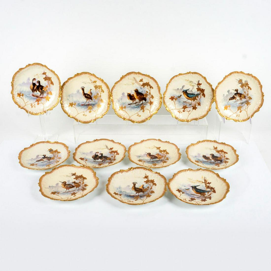 12pc Antique Limoges France Porcelain Bird Plates: Collection of twelve highly decorated plates with scalloped gilded rims and various hand painted birds in the center. Limoges backstamp. Dimensions: 1.25" H x 9.25" Diameter Manufacturer: Limoges Coun