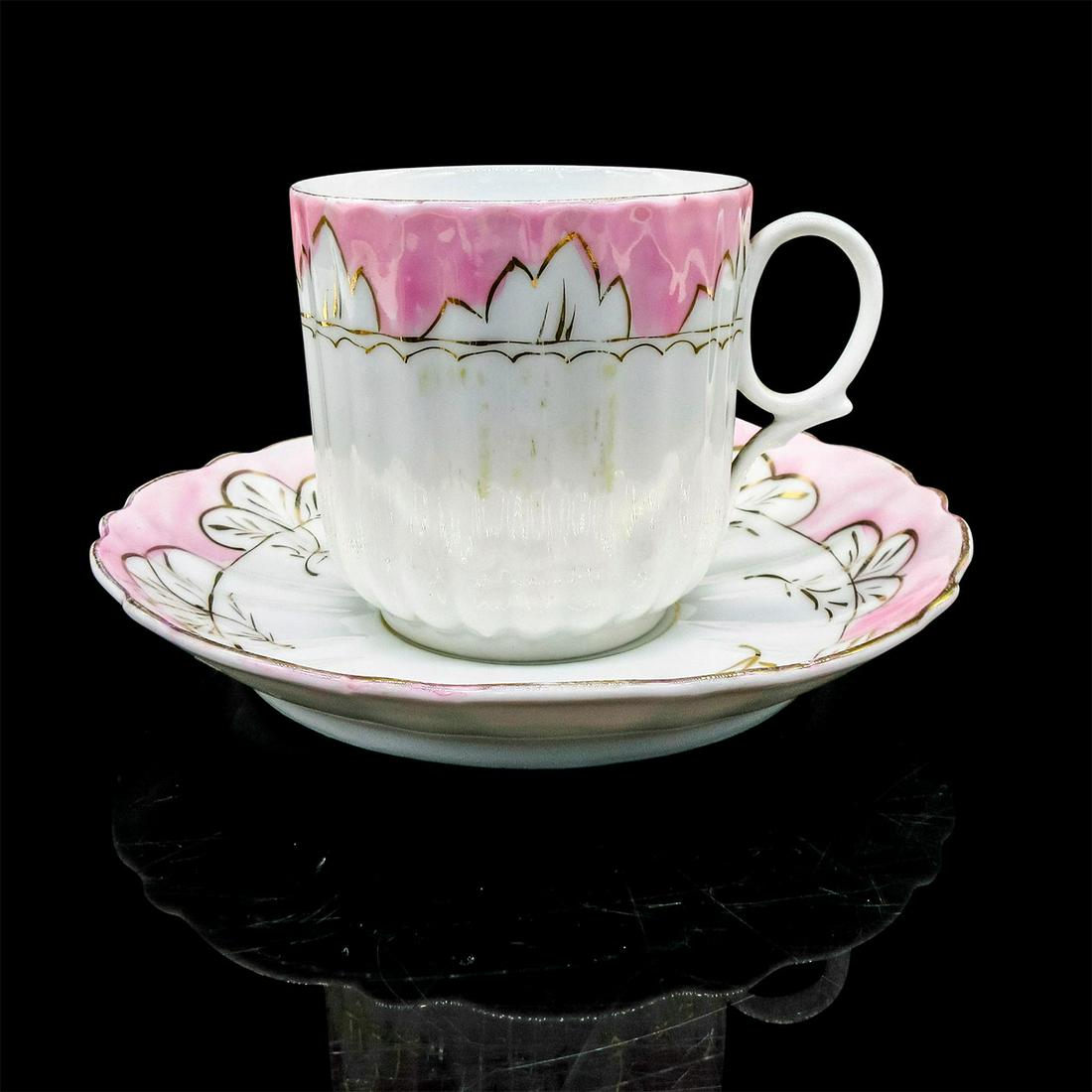 Vintage Mustache Tea Cup and Saucer: White and pink porcelain with handpainted gold tone design and rim. Moustache partition to protect moustache from beverage. Marked in factory blue writting, not legible. Cup size - 3.5"H x 3.5"