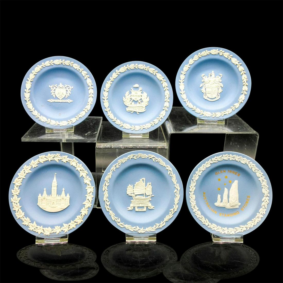 6pc Wedgwood Jasperware Trinket Dishes: Six dishes with various sprigged designs and motifs. Wedgwood backstamp. Variety of dishes including the Ottawa Parliament building, Glen Innes Standing Stones Australia and Hong Kong 1977. Issued: 20