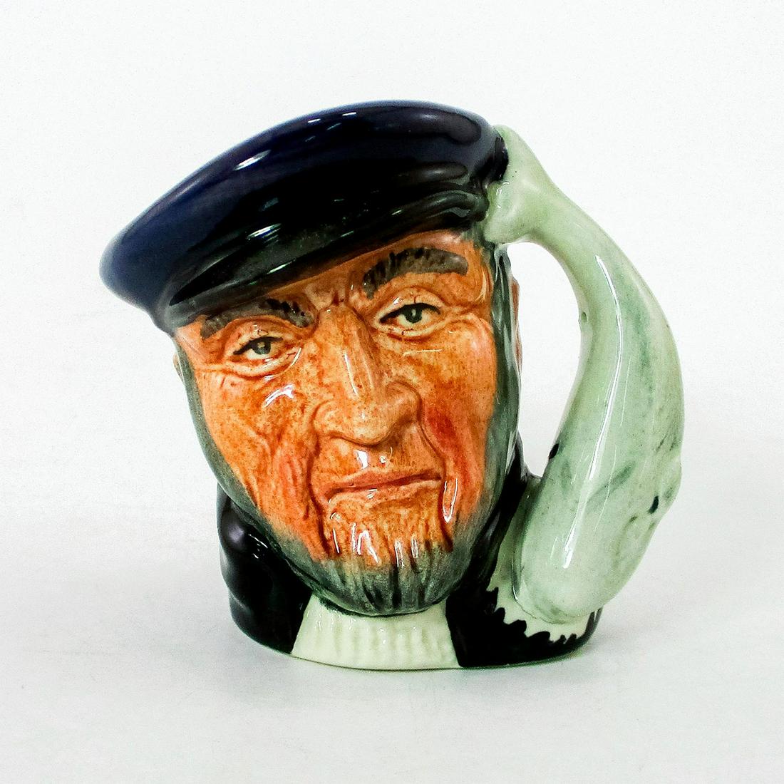 Capt Ahab D6522 - Mini - Royal Doulton Character Jug: Blue cap; black coat; white sweater. Captain Ahab sailed the whaler, Pequot, in Herman Melville's great 19th century American classic, "Moby Dick". He lost a leg and then his life in pursuit of the gr