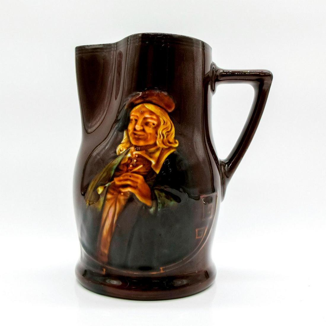 Royal Doulton Kingsware Pitcher, Hogarth: Dark rich brown glaze; relief of Hogarth with pipe. Royal Doulton backstamp. Inscribed "It is hard for an empty bag, to stand upright." on back. #kingsware #queensware Issued: 20th c. Dimensions: 5.5"