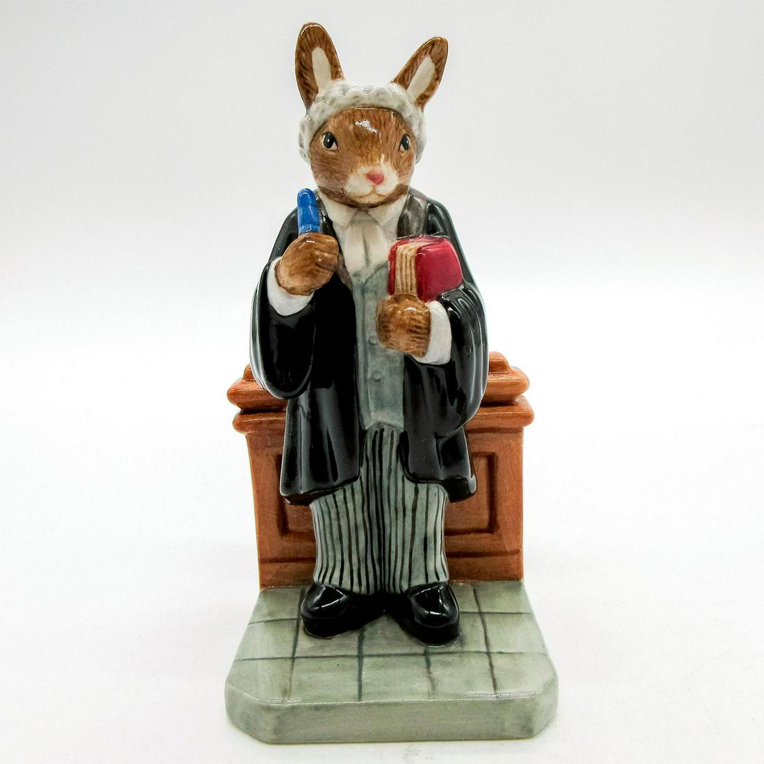 Barrister DB374 - Royal Doulton Bunnykins: Black robe, grey waistcoat, white shirt, grey and black coloration. Part of the Professions Collection. Royal Doulton backstamp. Issued: 2005 Dimensions: 4.75"H Manufacturer: Royal Doulton Country of 