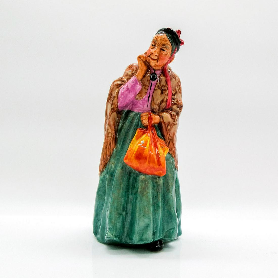 Bridget HN2070 - Royal Doulton Figurine: Harradine Classics series. Bridget with her tan shawl and yellow handbag goes out for a stroll through the park. Royal Doulton backstamp. Artist: Leslie Harradine Issued: 1951 - 1973 Dimensions: 7.75"