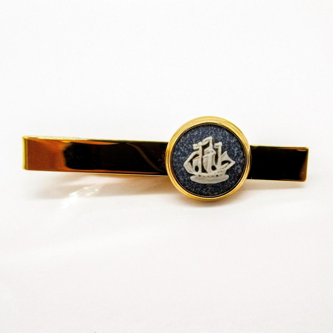Wedgwood Jasperware Tie Clip, Sailing Ship: Gold toned tie clip with white relief of a sailing ship on blue speckled white Jasperware. Wedgwood incised backstamp. PAT No.2164082. Jasper front face: .5"W. Includes box. #Wedgwood #Jasperware
