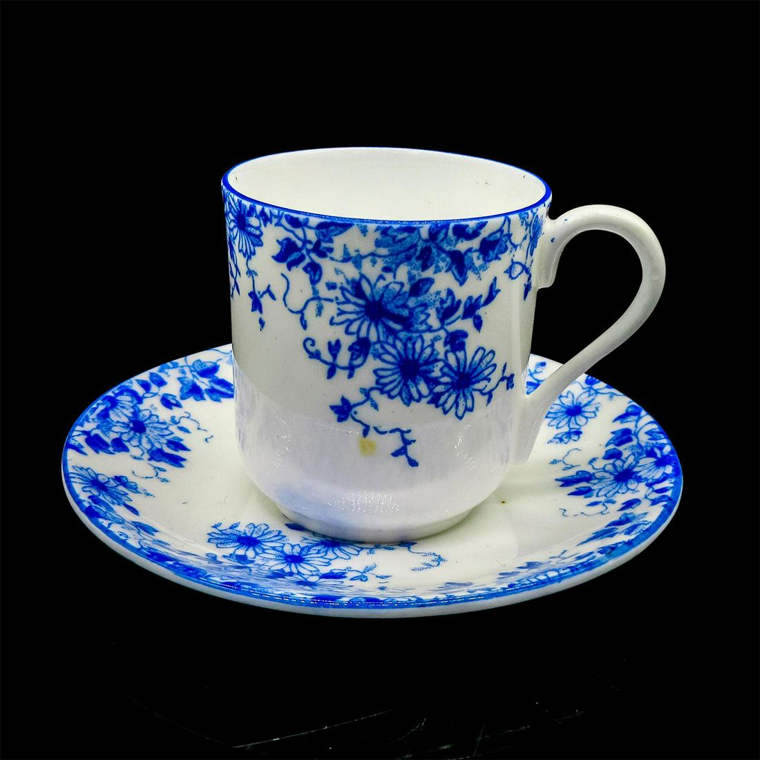 Shelley England Mini Cup and Saucer, Dainty Blue: Vintage bone china miniature tea cup and saucer in a delicate blue floral motif. Shelley England backstamp. Cup size - 1.75"H x 1.5" diameter. Saucer size - 3" diameter. Issued: 20th c. Ma