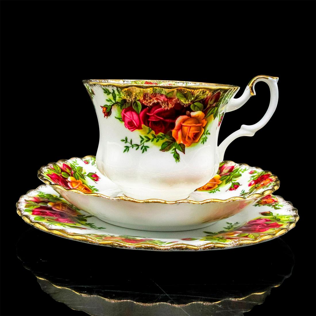 Royal Albert Tea Set Trio, Country Roses: Bone china tea set with colorful rose design and gold tone rim. Royal Albert backstamp. Cup size - 2.75"H x 3.5" diameter. Saucer size - 5.5" diameter. Plate size - 6.25". Issued: 20th